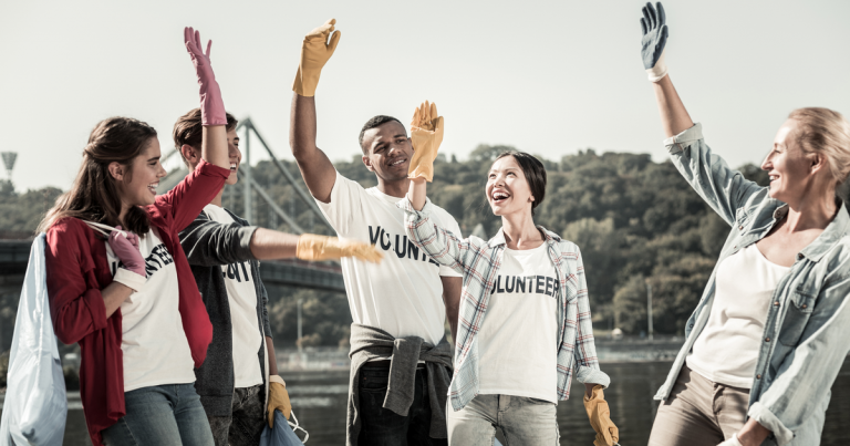 Volunteer team celebrating a successful Giving Tuesday 2018