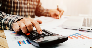 Owner calculating small business payroll